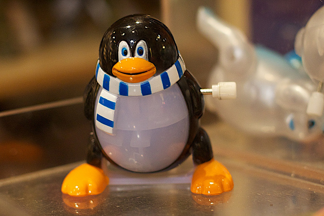 Picture of wind up Tux (Linux mascot) toy.